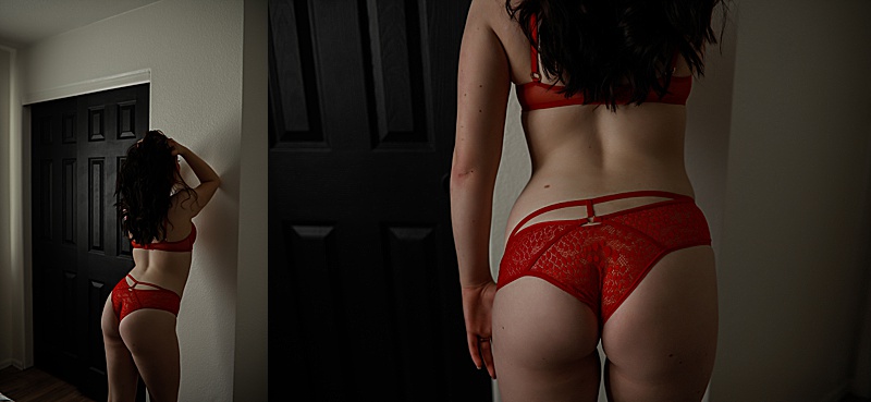 boudoir-photos- of-Woman-wearing-red-lingerie-standind-facing-a-wall-with-elbow-up-and-other-hand-pulling-down-on-panties