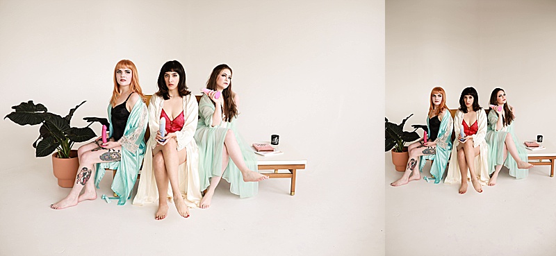 Gallery-of-three-women-sitting-on-a-yellow-couch-wearing-vintage-lingerie