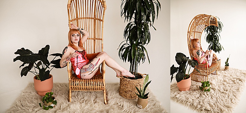 Gallery-of-a-woman-wearing-a-vintage-pink-silk-pj-set-sitting-in-a-rattan-chair-eating-candy