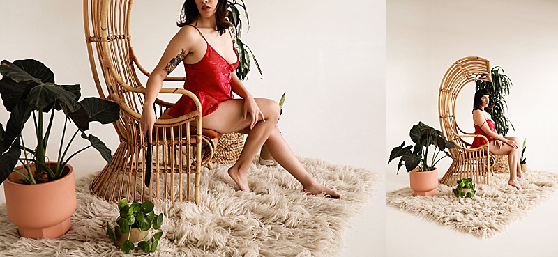 Gallery-of-a-woman-wearing-a-vintage-red-silk-pj-set-sitting-in-a-rattan-chair