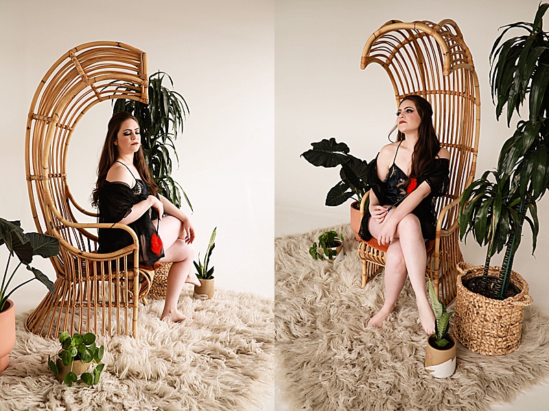 Gallery-of-a-woman-wearing-a-vintage-black-silk-pj-set-sitting-in-a-rattan-chair