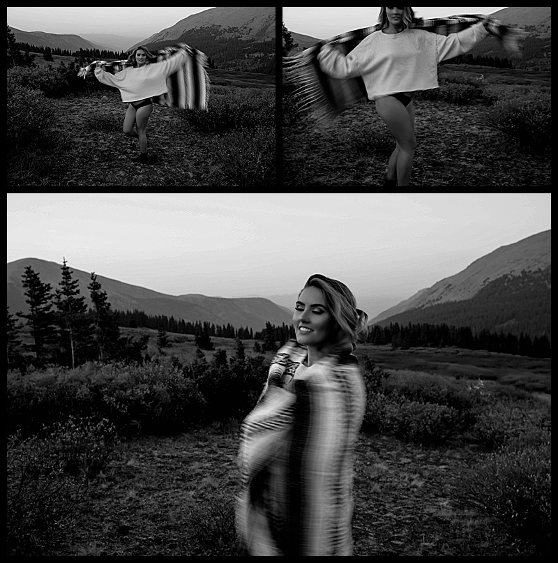 Colorado-boudoir-image-of-a-woman-wrapped-in-a-blanket-standing-at-the-top-of-a-mountain