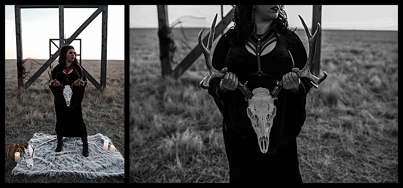 Witchy-women-dressed-in-lingerie-and-cloaks-posing-in-front-of-wooden-structures-in-the-middle-of-a-field