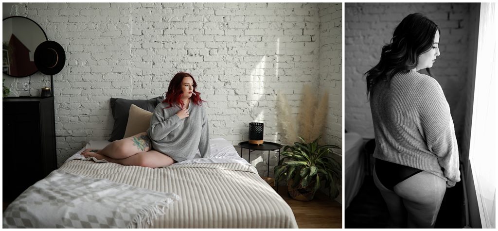 Colorado-boudoir-photos-of-a-woman-laying-on-a-bed-with-dark-pink-hair-wearing-grey-sweater-and-black-bottoms