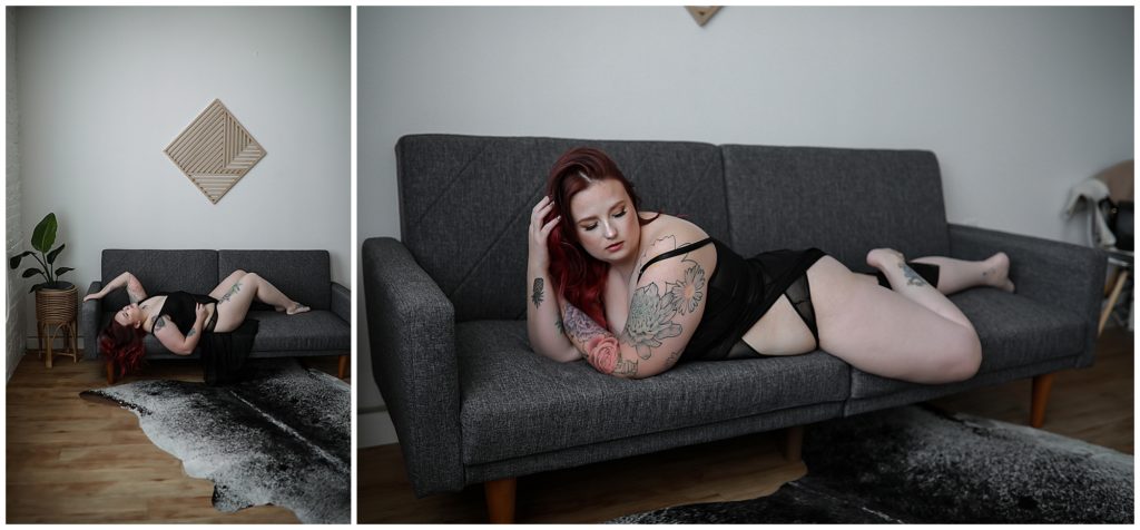 Colorado-boudoir-photos-of-a-woman-wearing-a-shear-black-dress-posing-on-a-grey-couch