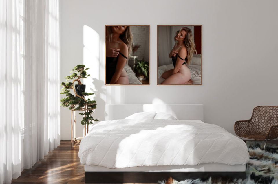 White bedroom with two large boudoir images above bed