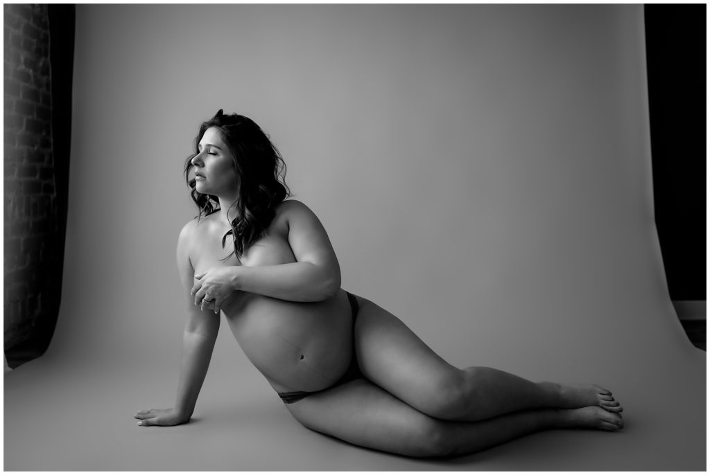 Black and white images of naked pregnant woman.