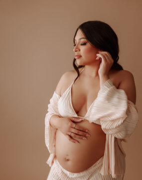 Pregnant woman in silk pjs.
