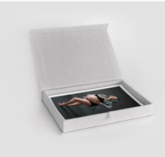 Linen photo box with maternity photos inside.